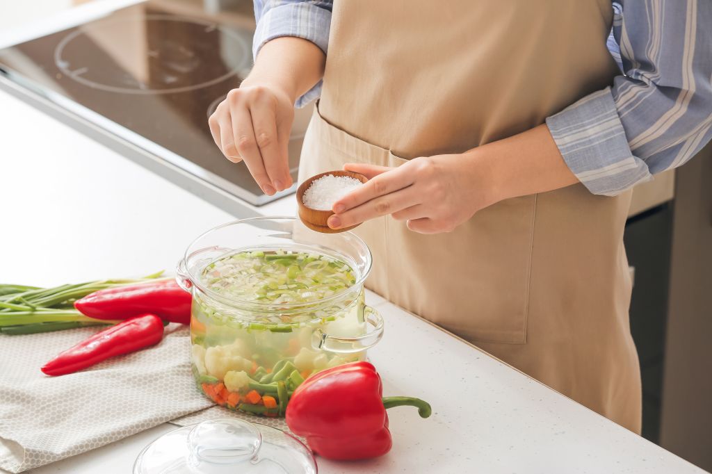 Adding salt to dish 