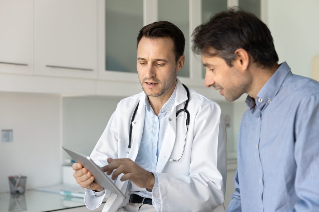 Man speaking to his doctor