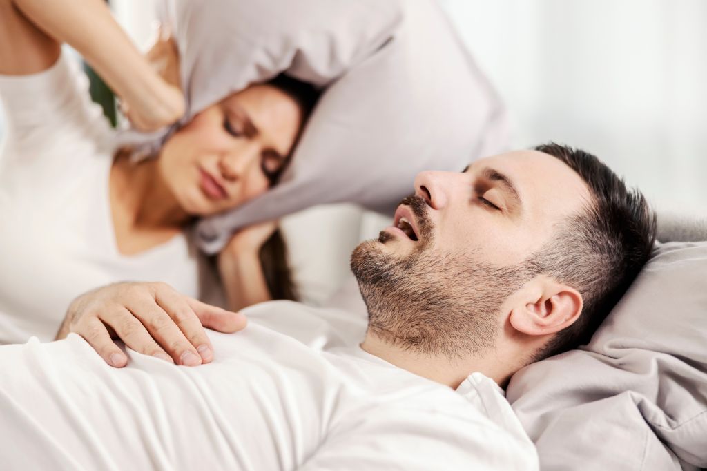 Man with sleep apnea illustrating why am I still tired after 8 hours of sleep