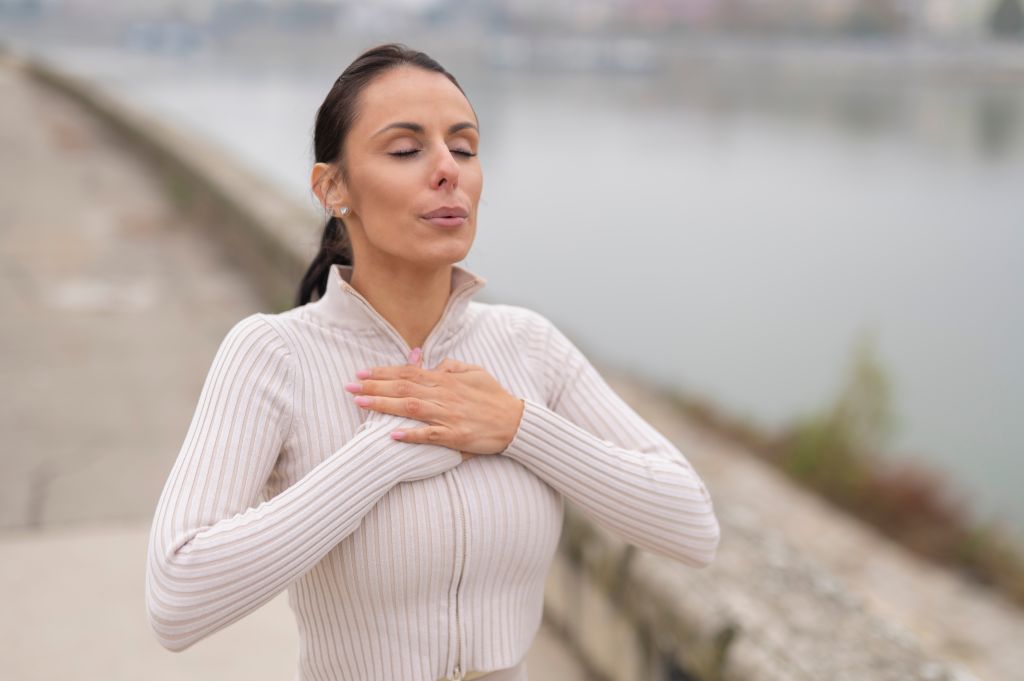 Woman taking a deep breath

