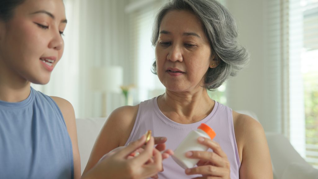 Woman taking a supplement
