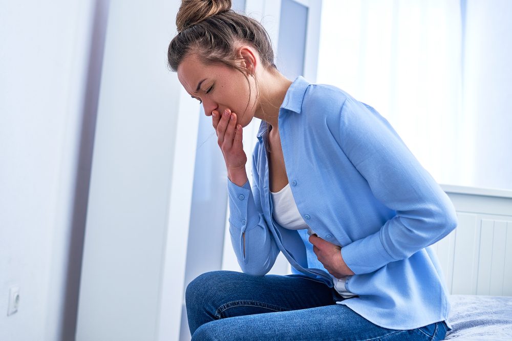 Woman feeling nauseated