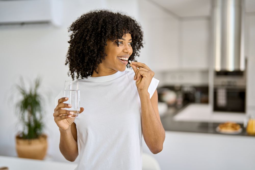 Woman taking a supplement 