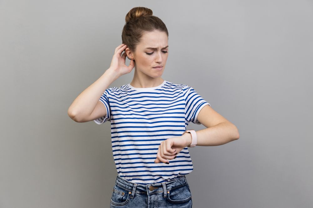 Woman looking at clock 