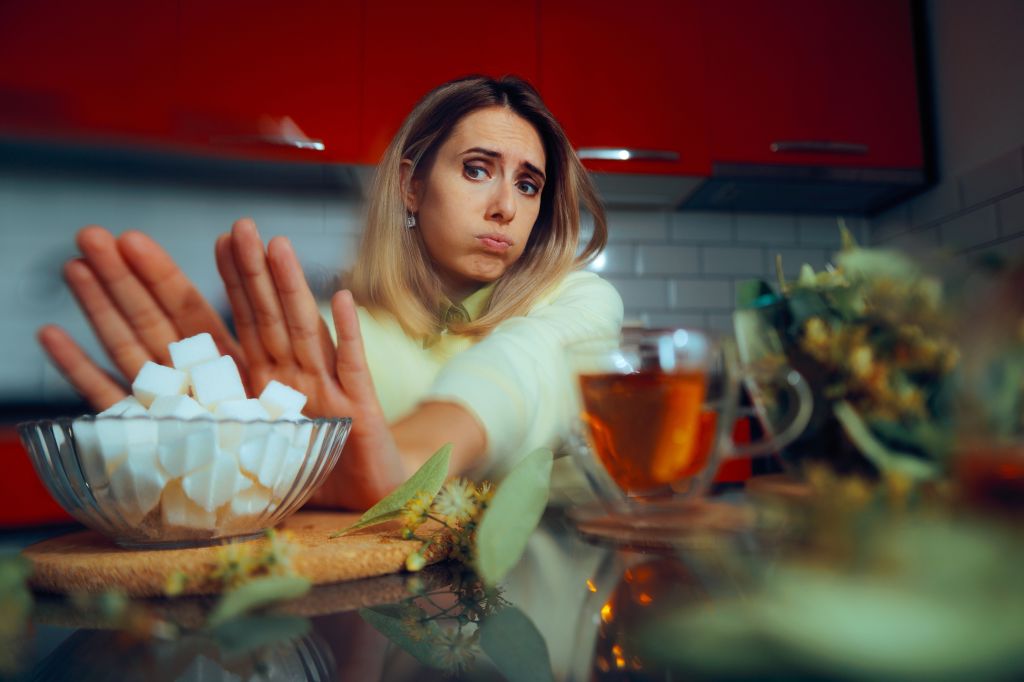 Woman saying no to sugar