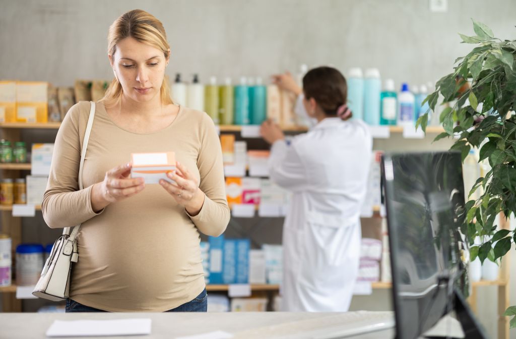 Woman choosing a supplement