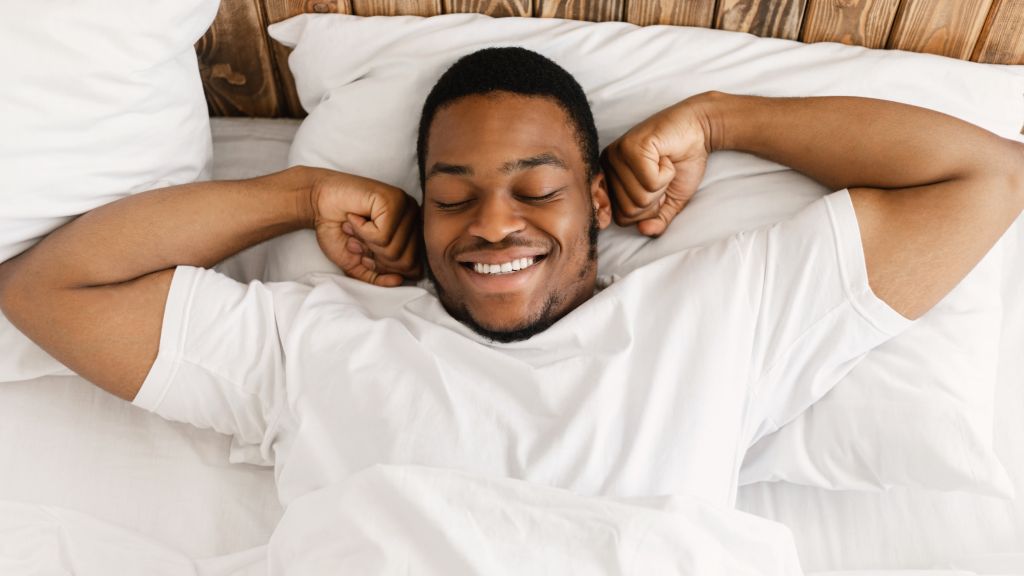 Man waking up feeling well rested