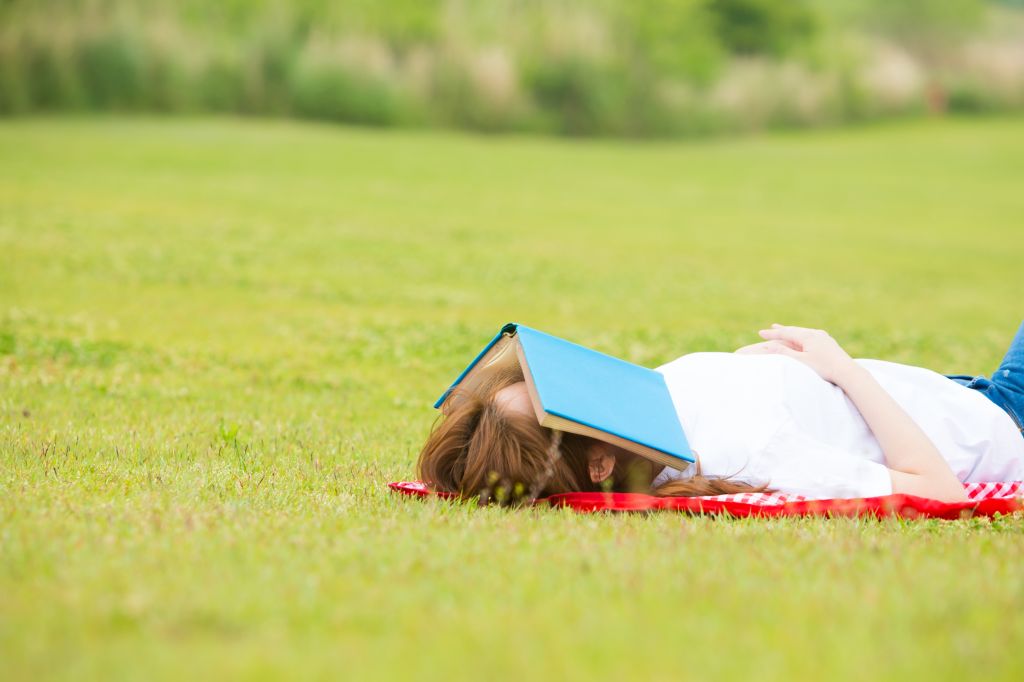 Person relaxing on blanket