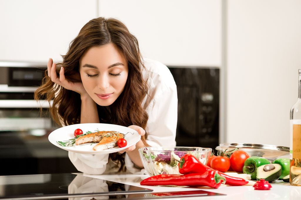 Woman enjoying fish 
