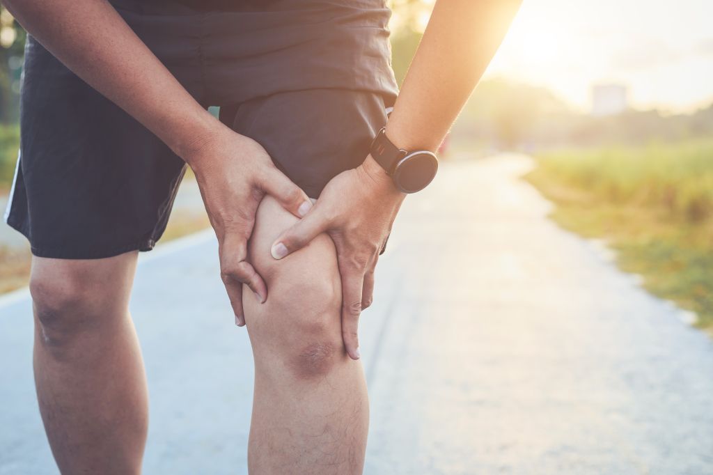 Man holding one knee