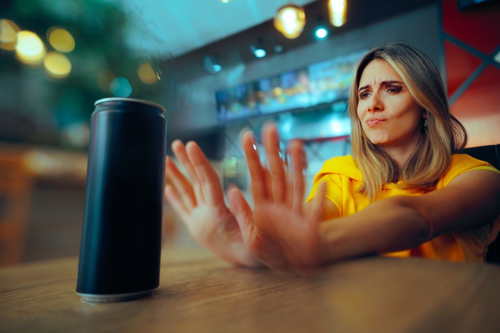 Woman refusing an energy drink