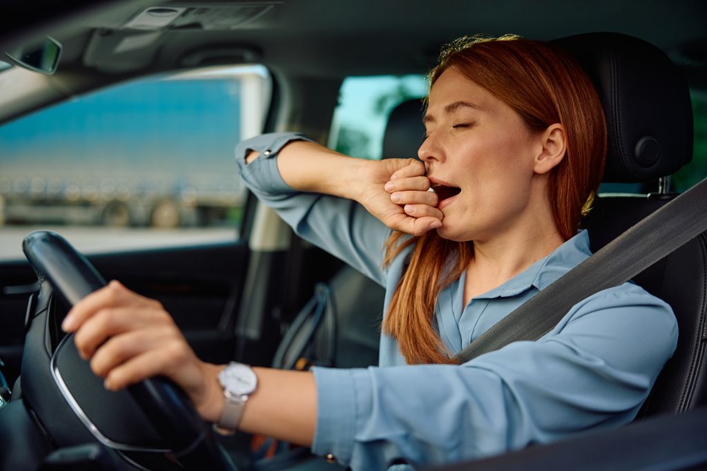 Tired woman driving 
