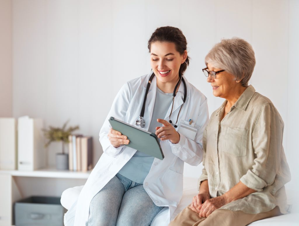 Older woman speaking with doctor