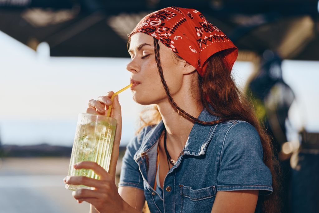 Woman drinking from straw